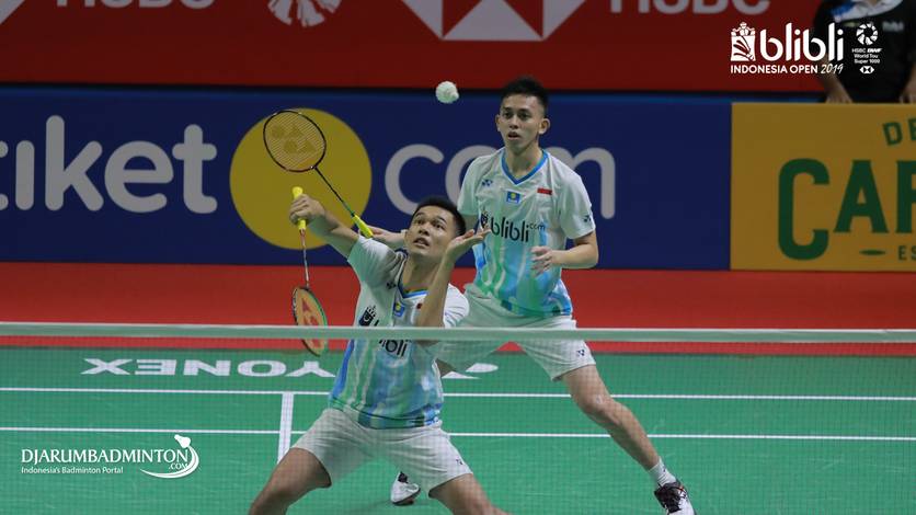 Fajar Alfian/Muhammad Rian Ardianto (Indonesia) returning shuttlecock.