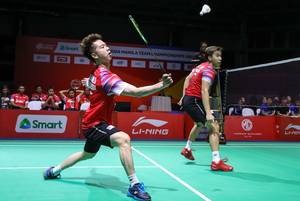 Kevin Sanjaya Sukamuljo/Marcus Fernaldi Gideon (Indonesia) menyambut pengembalian.