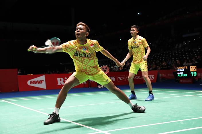 Fajar Alfian/Muhammad Rian Ardianto mengembalikan shuttlecock. Fajar Alfian/Muhammad Rian Ardianto mengembalikan shuttlecock.