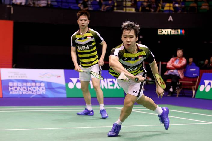 Kevin Sanjaya Sukamuljo/Marcus Fernaldi Gideon berusaha menghadang serangan.